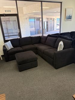 Black sectional with ottoman