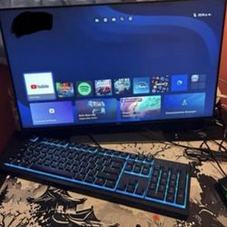 Gaming Chair And Monitor With Razor Keyboard And A Mouse 