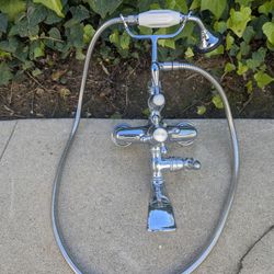 Vintage-style telephone clawfoot tub faucet filler with a handheld shower attachment