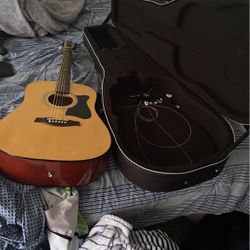 Used Acoustic Guitar, Strings, Picks, And Fret Capo
