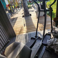 MAKE OFFER Elliptical  stationary bike,  inversion table, and foldable weight bench