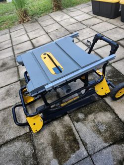 DeWalt portable table saw with rolling stand