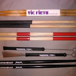 Drumsticks and brushes. Stick bag. Ahead, Regal tip, Lightning rods. Percussion