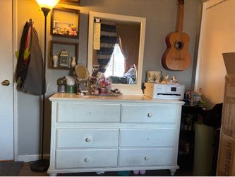 Dresser with attached mirror