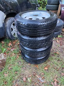 4 like new 225/60/16 tires and alloy wheels Of 2006 Kia Optima