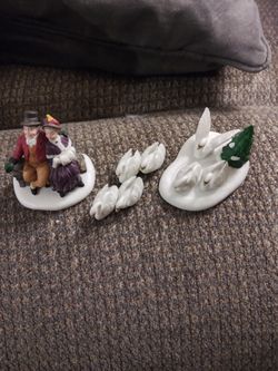 Seven Swans a Swimming and couple on bench watching.   Porcelain.