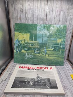 Farmall metal sign and Farmall photo archive book