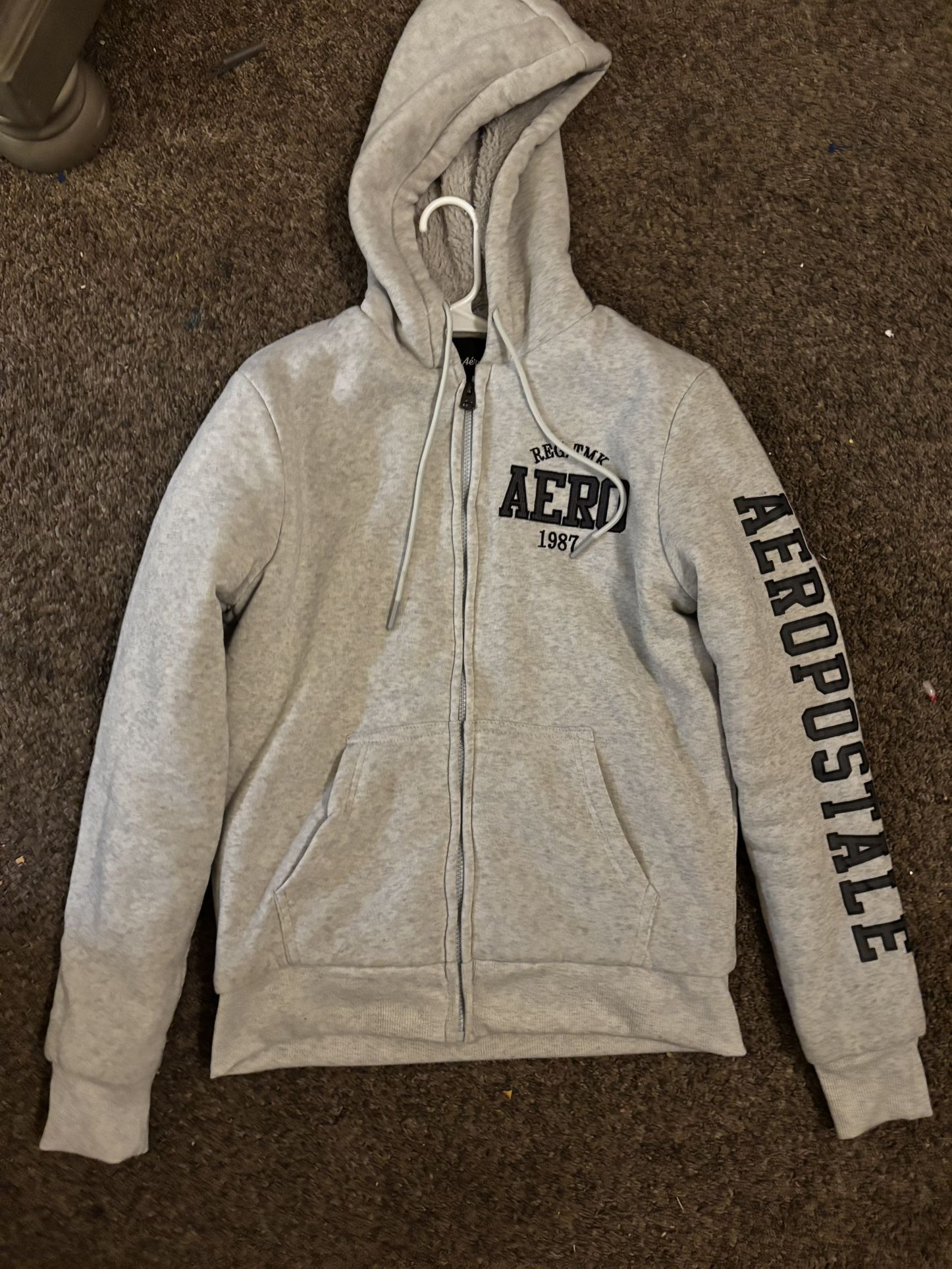 AeroPostale Zip Up Hoodie with Aeropostale on the sleeve