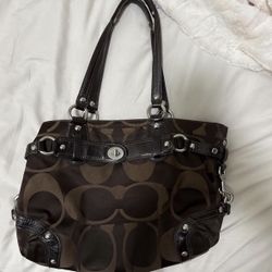 Brown Coach purse with silver accents 