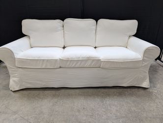 Versatile White Slipcovered Three-Seat Sofa