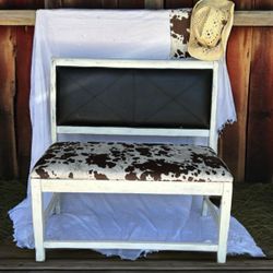 Rustic Bench With cow Patterned Cushion