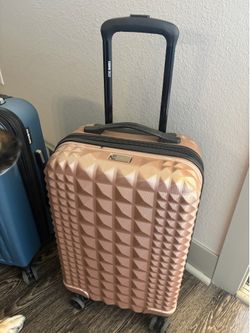 Blue Luggage (pink sold) has handle & wheels