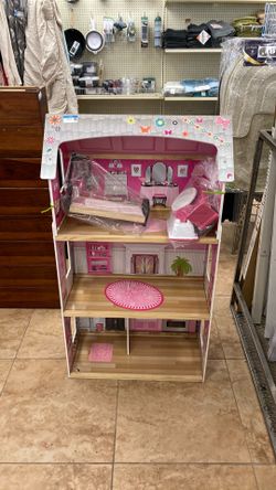 Pink and white dollhouse