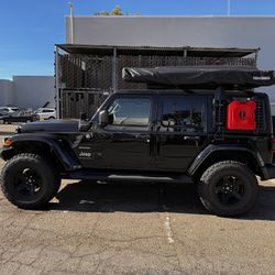 Overlanding Setup. Rooftop Tent, KC Ditch Lights, Winch and Bumper, Yakima awning. 