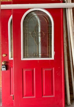 Double Entry Door with Arched Leaded Glass Panels