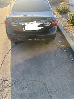 Black Sedan with Dual Exhaust