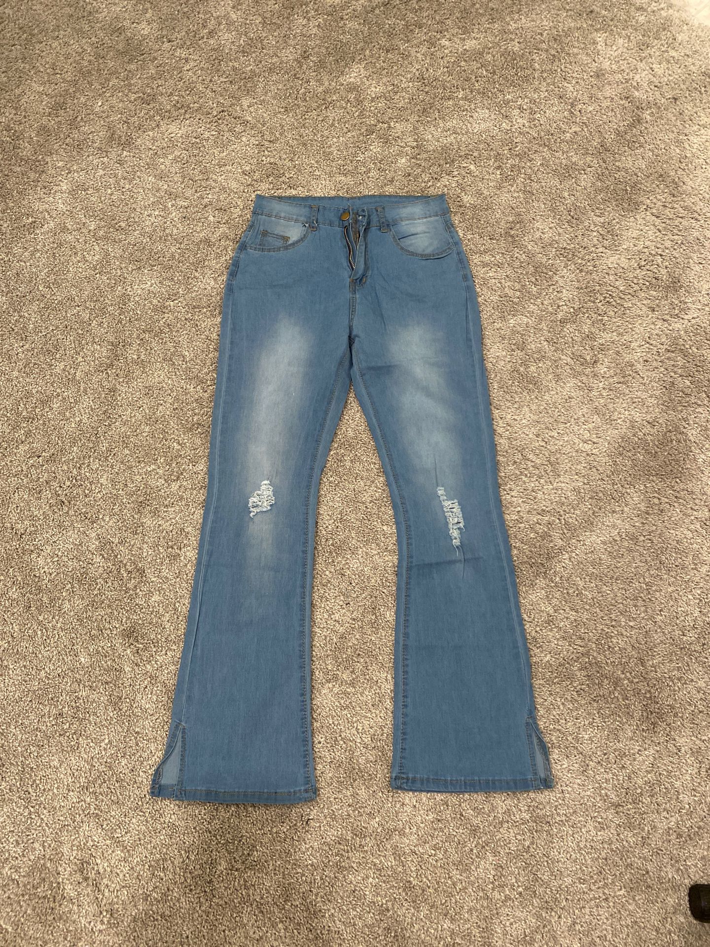 Light washed boot cut jeans, brand new, size small.