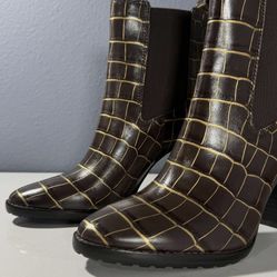 Ralph Lauren Mylah stretch ankle Chelsea boots in a chocolate brown croc-embossed leather finish with contrasting gold-colored detailing.