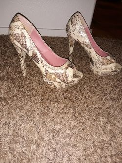 Open toed, faux snake skin heels. Still Available