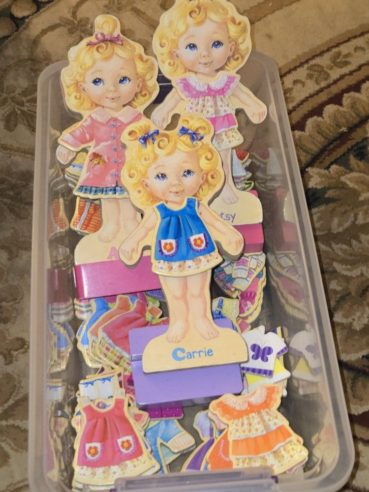 set of T.S. Shure Teeny Tiny Triplets Wooden Magnetic Dress-Up Dolls.