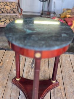Brown wooden table with marble top