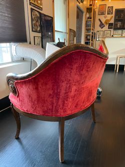 Antique chair with carved wood arm