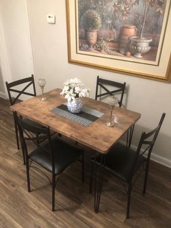 Like new dining table set with 4 black leather chairs