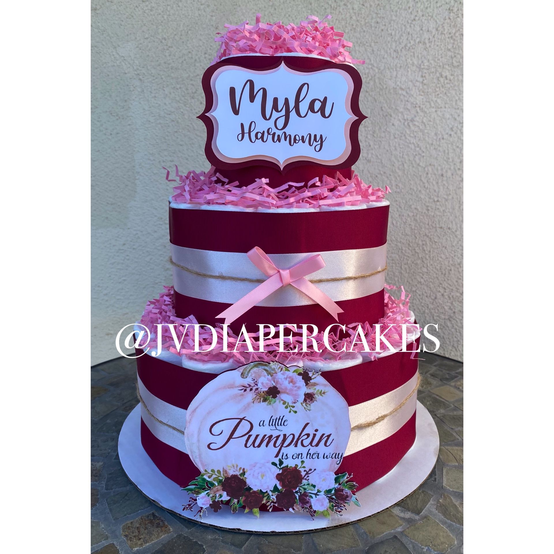 Burgundy and pink fall pumpkin themed diaper cake great for baby showers