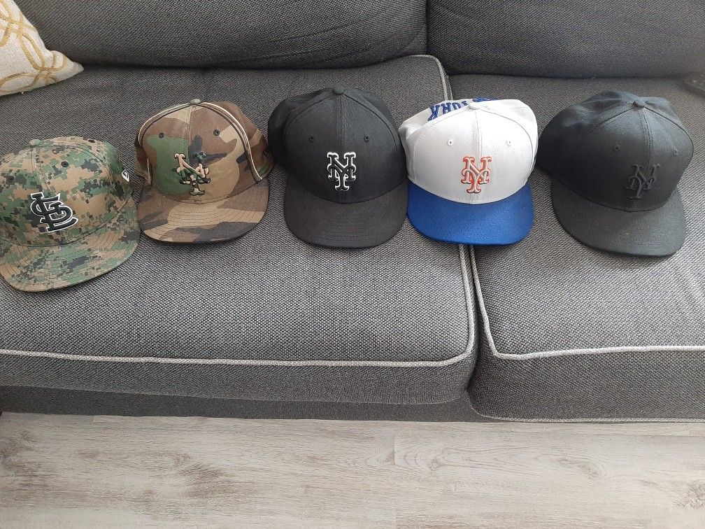 Mets hats and 1 cardinals