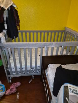 Grey baby crib