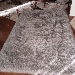 Grey shag rug. Approximately 5x8