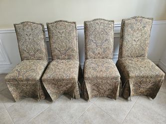 Four elegant skirted Parsons dining chairs