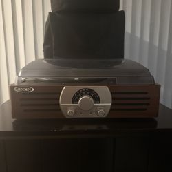 Retro-style Jensen turntable with radio and built-in speakers