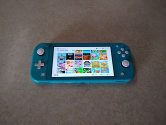 NINTENDO SWITCH LITE with 50 POPULAR SWITCH GAMES and 7000 RETRO GAMES