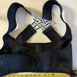 BACK BRACE. IT's APPROXIMATELY 15 Inches ACROSS. 