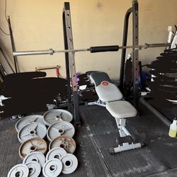 Bench press/squat rack with 7ft 45lbs bar plus 250lbs of Olympic weights