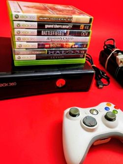 Microsoft Xbox 360 slim with 2 controllers 8 games HDMI cord power supply