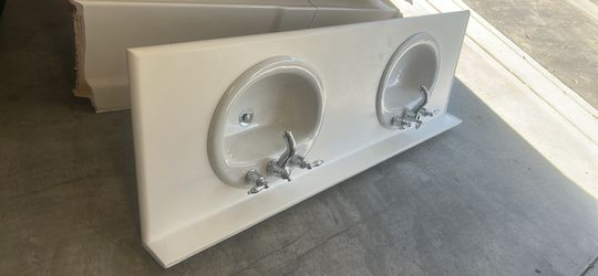 Double vanity sink with faucets