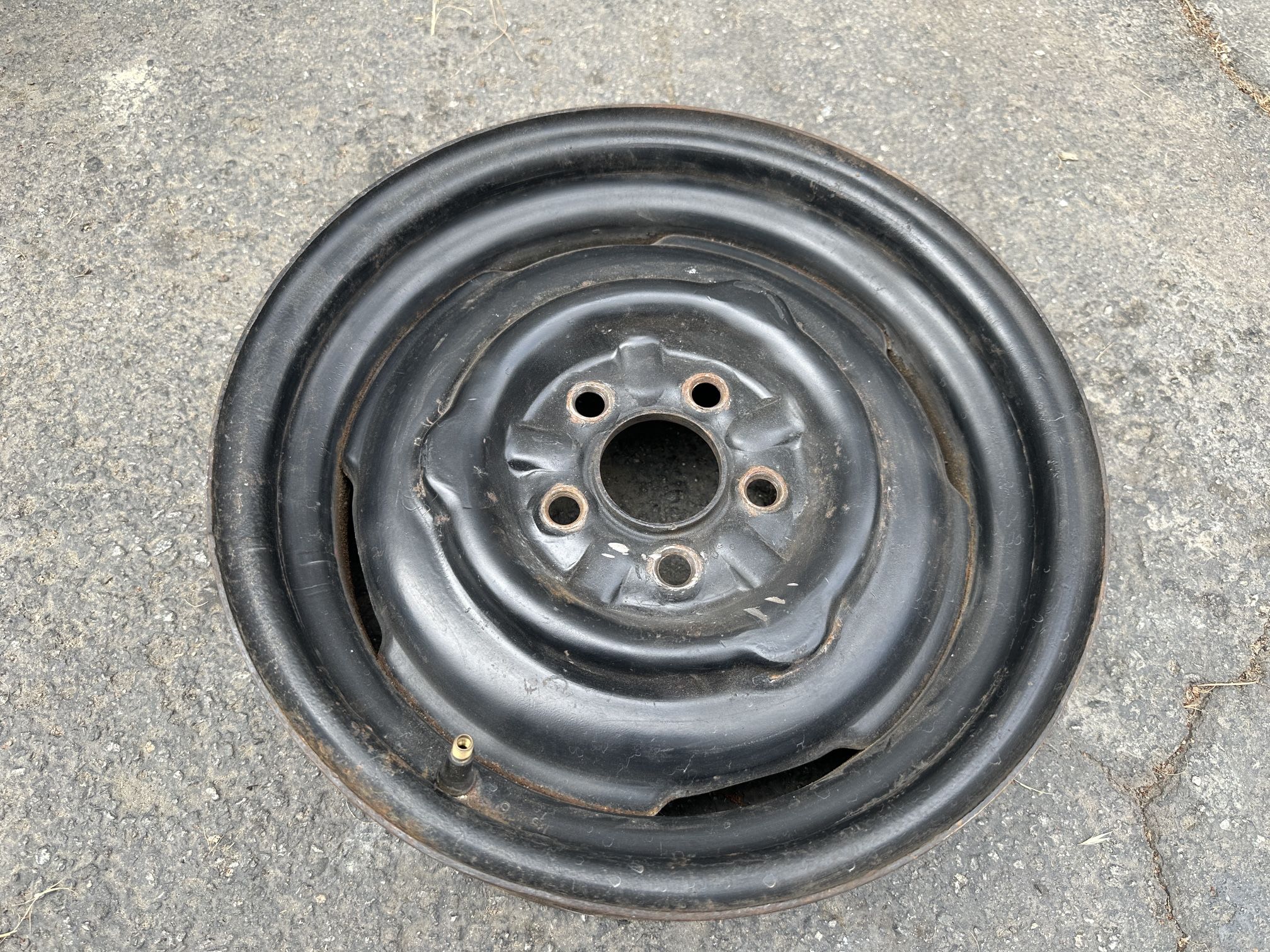 One stock 14 inch steel rim. Mopar small bolt pattern. 5 on 4 inch for