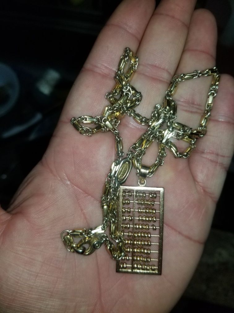 18kt SOLD GOLD DESIGNER CHAIN AND ABACUS PENDANT