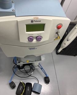 A Q-Switch Nd:YAG - professional-grade aesthetic device used for tattoo removal and treating pigmentation concerns such as dark spots, freckles, and s