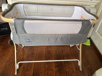 Grey bedside bassinet