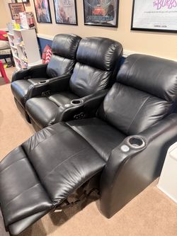 Black reclining theater chairs