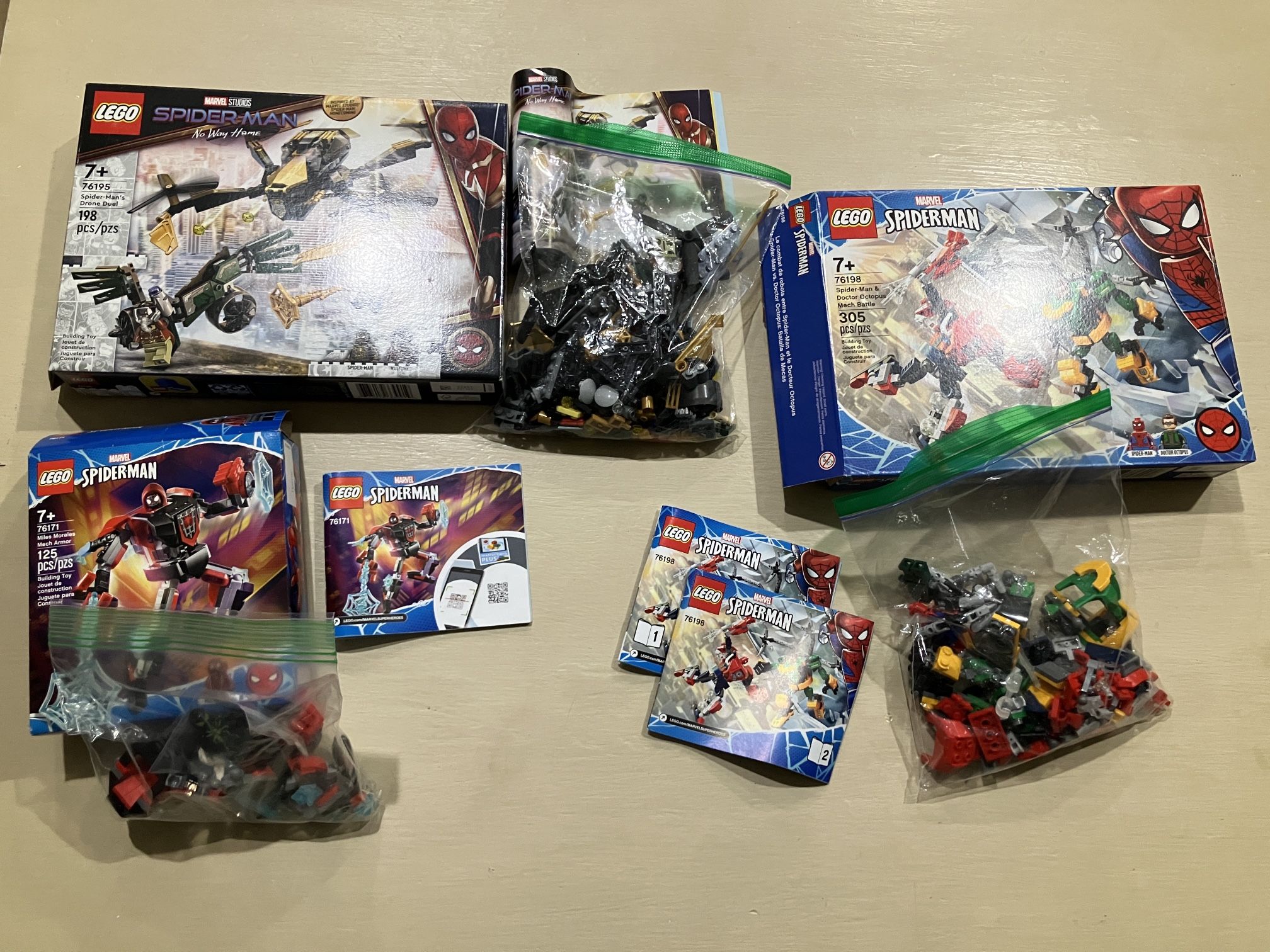 Bundle - Drone Duel Vulture Set 76195, Spider-Man & Doctor Octopus Mech Battle, Miles Morales Mech Armor 76171, & black and green suit from set 76175