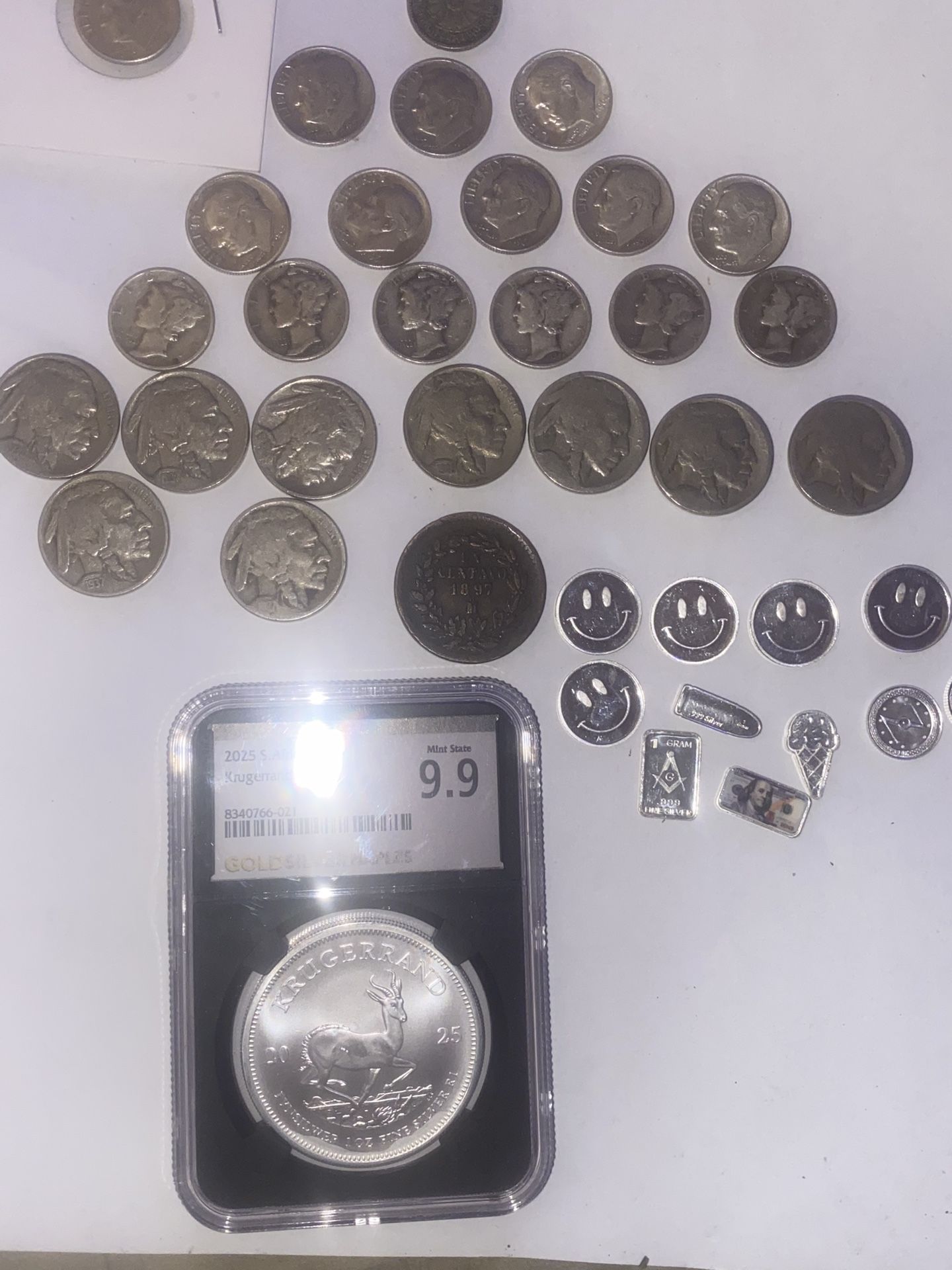 One large silver light with a 9.9 cougar in in the black slab created by NGC