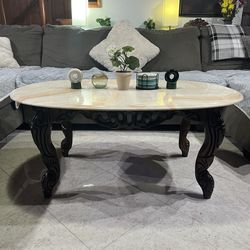 Oval Marble Look Coffee Table with Carved Wood Legs