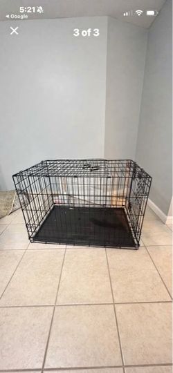 Durable black metal wire dog crate is a MidWest iCrate model 1536. It measures 36.62 L x 22.84 W x 24.81 H inches. The unit has a removable plastic tr