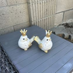2 wooden bird figurines with gold crown accents