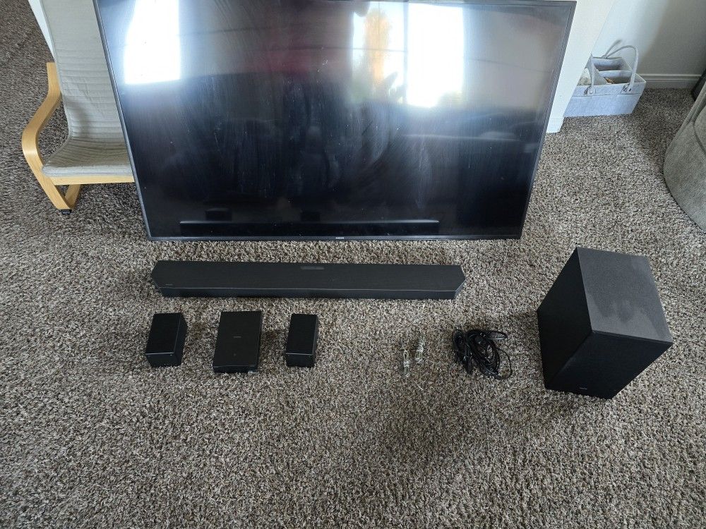 65 samsung smart tv and sound bar with wireless speakers 