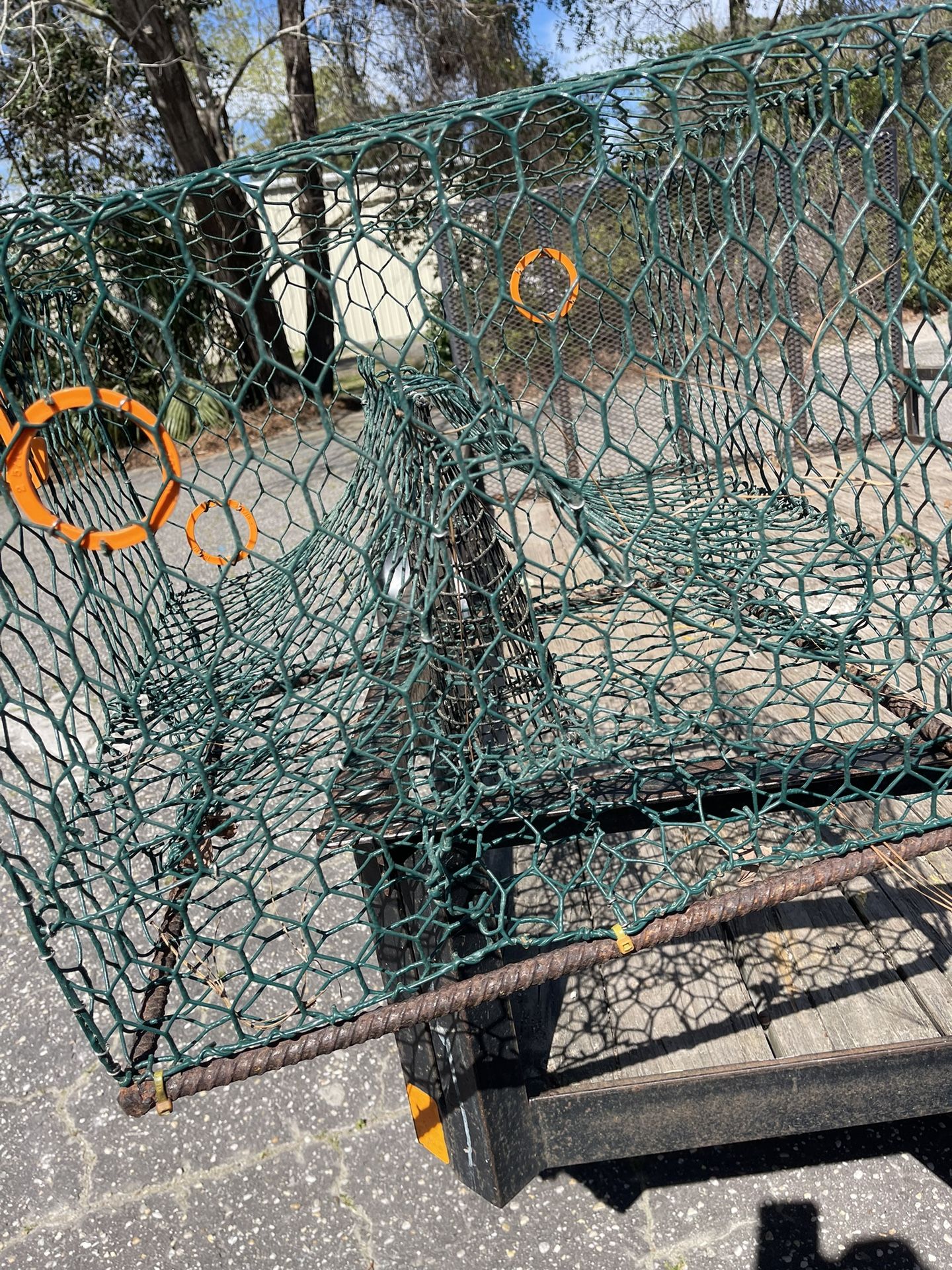 Crab trap, cast net in smaller crab traps